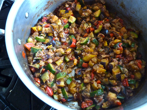 adding chili spices to veggies